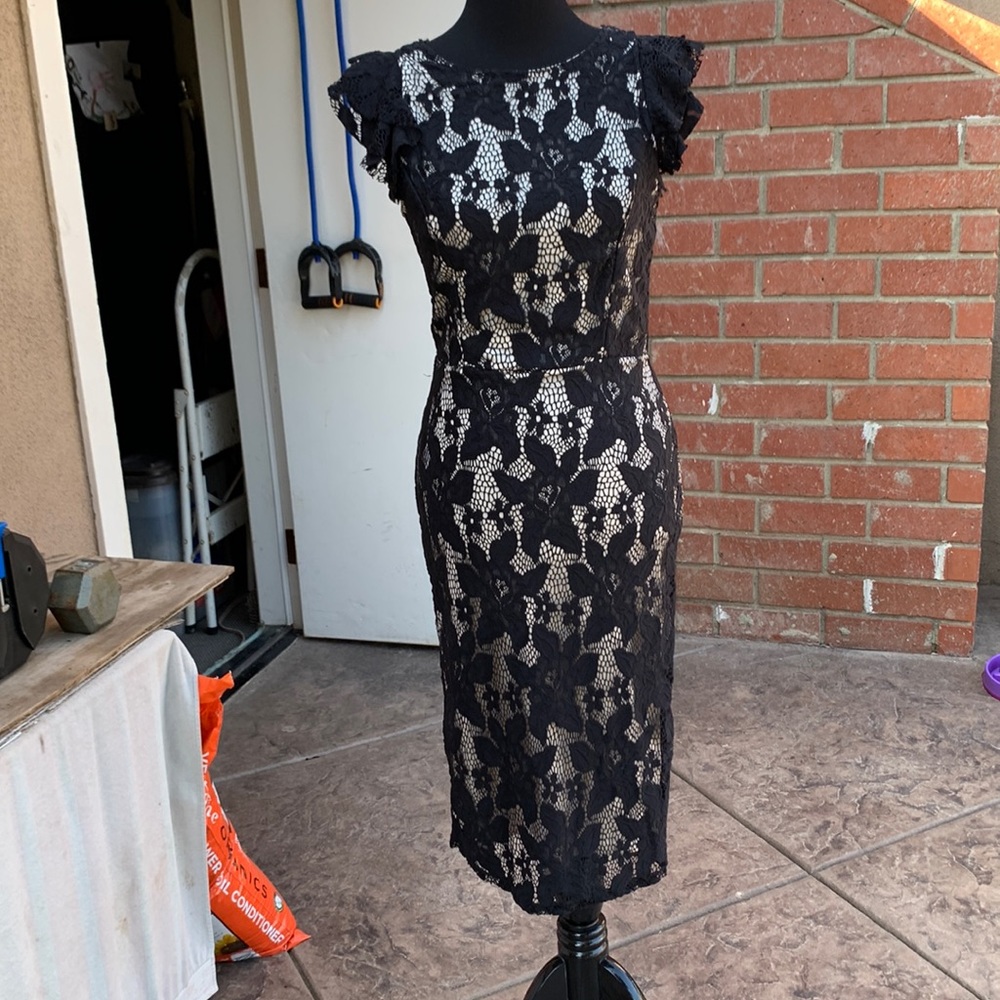 Black form fitting, flattering dress.